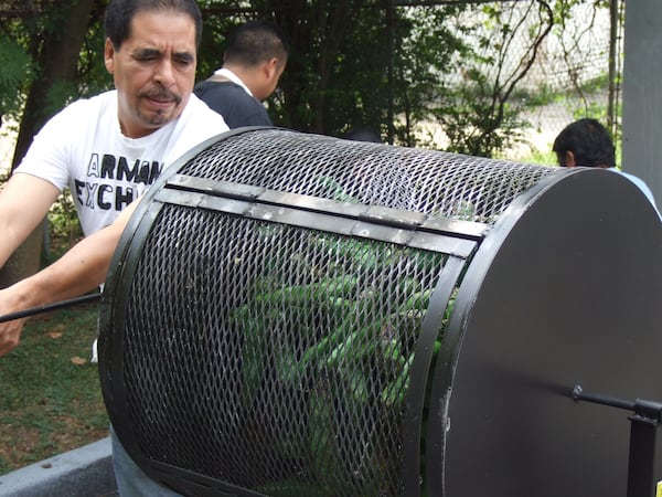 Taqueria del Sol executive chef Eddie Hernandez roasts Hatch green chiles. The restaurant will hold a cheeseburger cookout starring these special New Mexican chiles. (Courtesy of Taqueria del Sol)