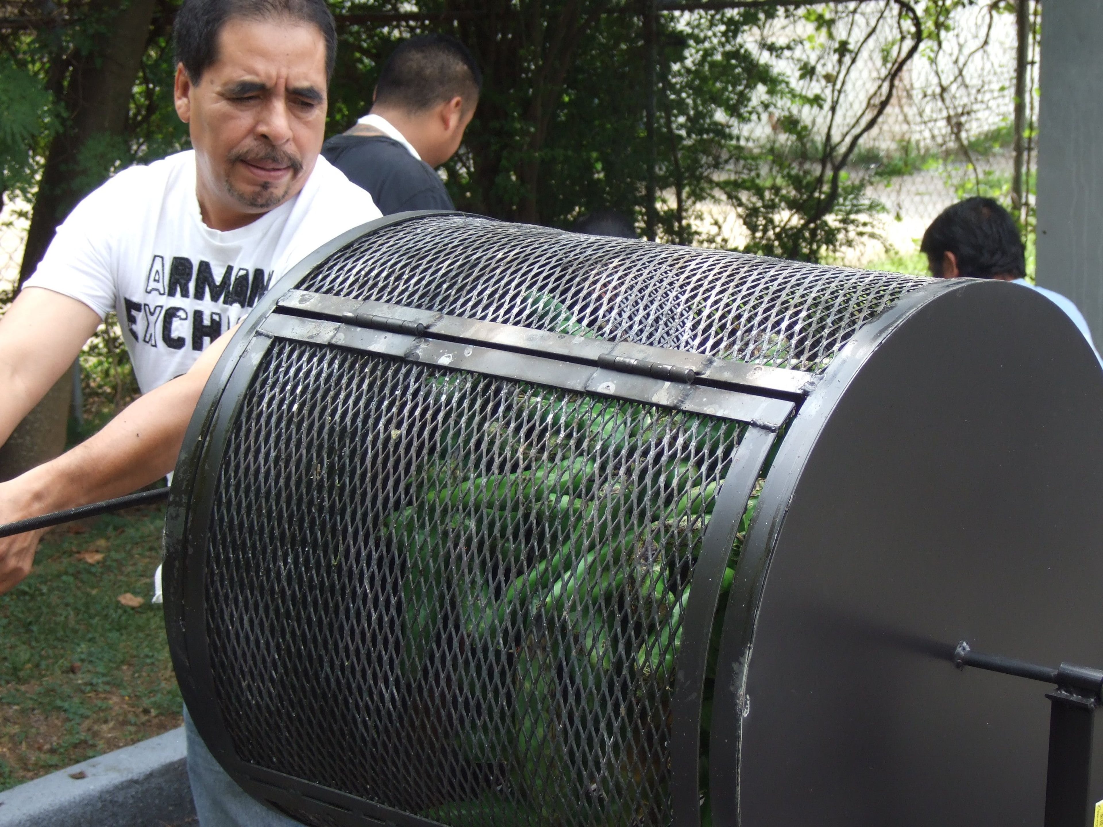 Taqueria del Sol executive chef Eddie Hernandez roasts Hatch green chiles. The restaurant will hold a cheeseburger cookout starring these special New Mexican chiles. (Courtesy of Taqueria del Sol)