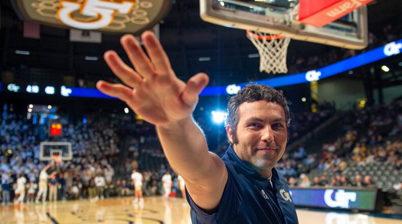 Georgia Tech Yellow Jackets head coach Josh Pastner wave at fans before a NCAA college basketball game against North Carolina Sunday, Dec. 5, 2021, in Atlanta. (AP Photo/Hakim Wright Sr.)