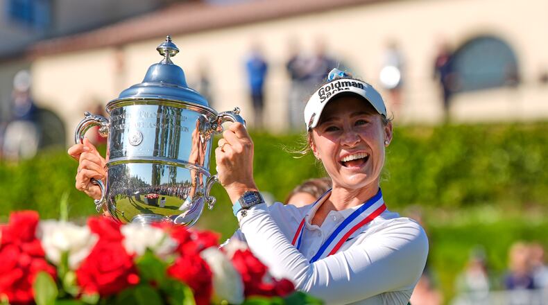 Nelly Korda holds up the trophy after winning the U.S. Women's Open golf tournament Sunday, June 7, 2026, in the Pacific Palisades area of Los Angeles. (AP Photo/Ashley Landis)
