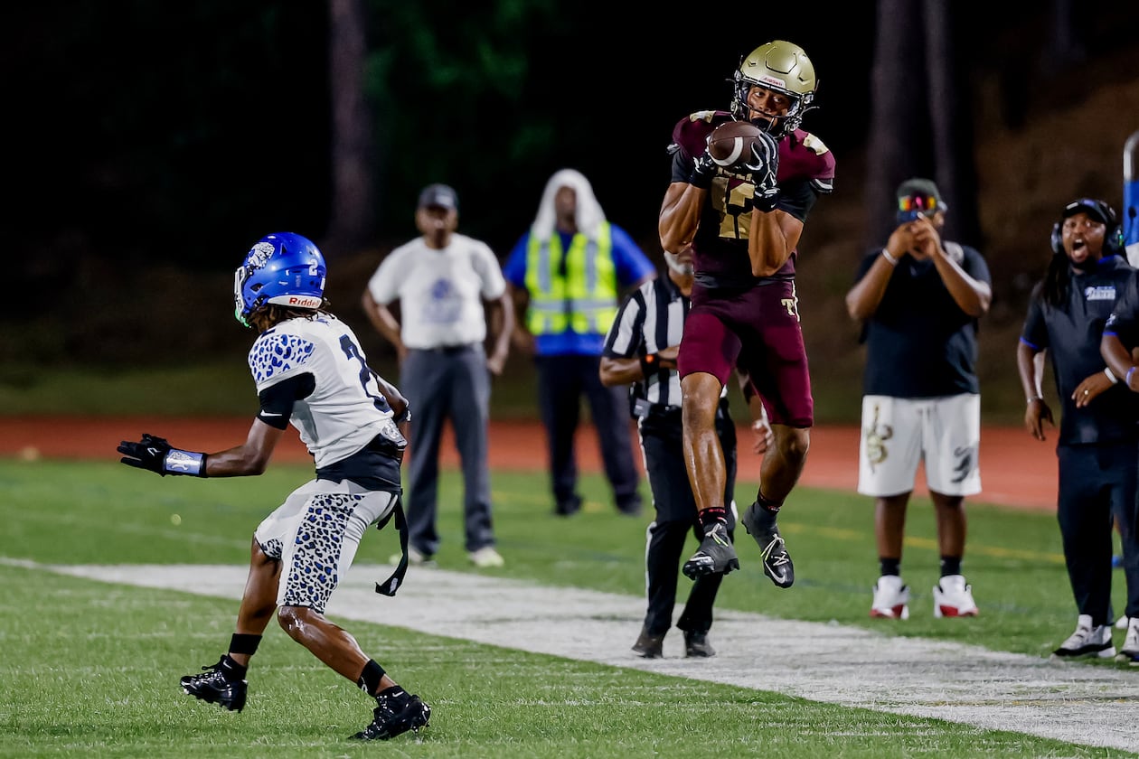 Tucker’s Jayden Joyner (right) makes a pass reception against Stephenson’s Aaryn Chastine during the second half of their game at Hallford Stadium on Friday, Sept. 4, 2026, in Clarkston. (Erik S. Lesser for the AJC)