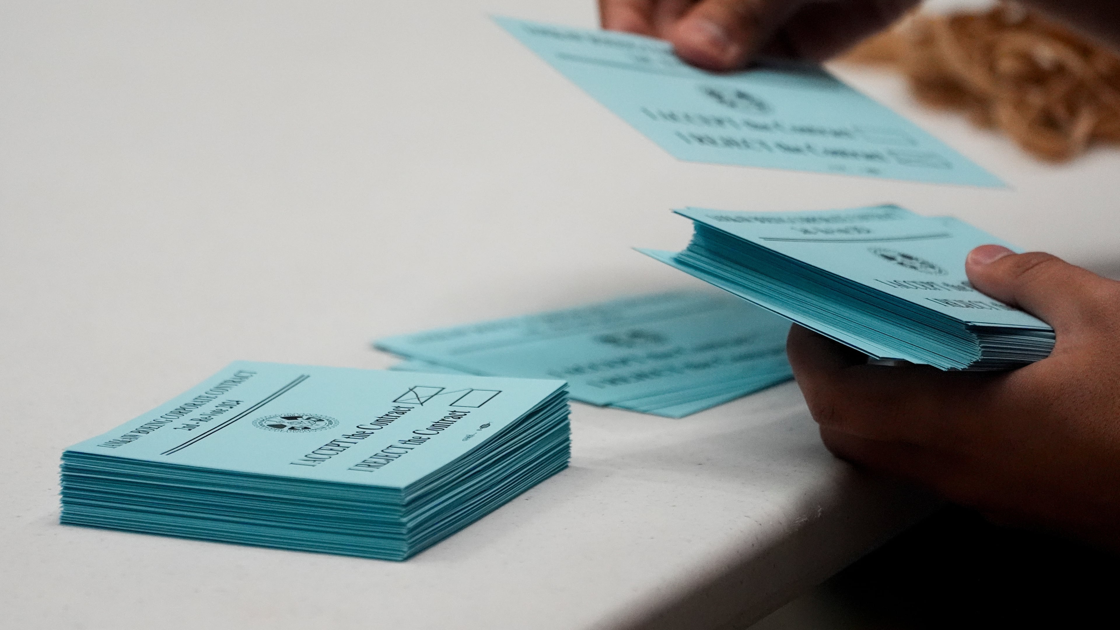 FILE - A volunteer sorts votes on a new contract offer from Boeing, Nov. 4, 2024, at the IAM District 751 Union Hall in Seattle. (AP Photo/Lindsey Wasson, File)