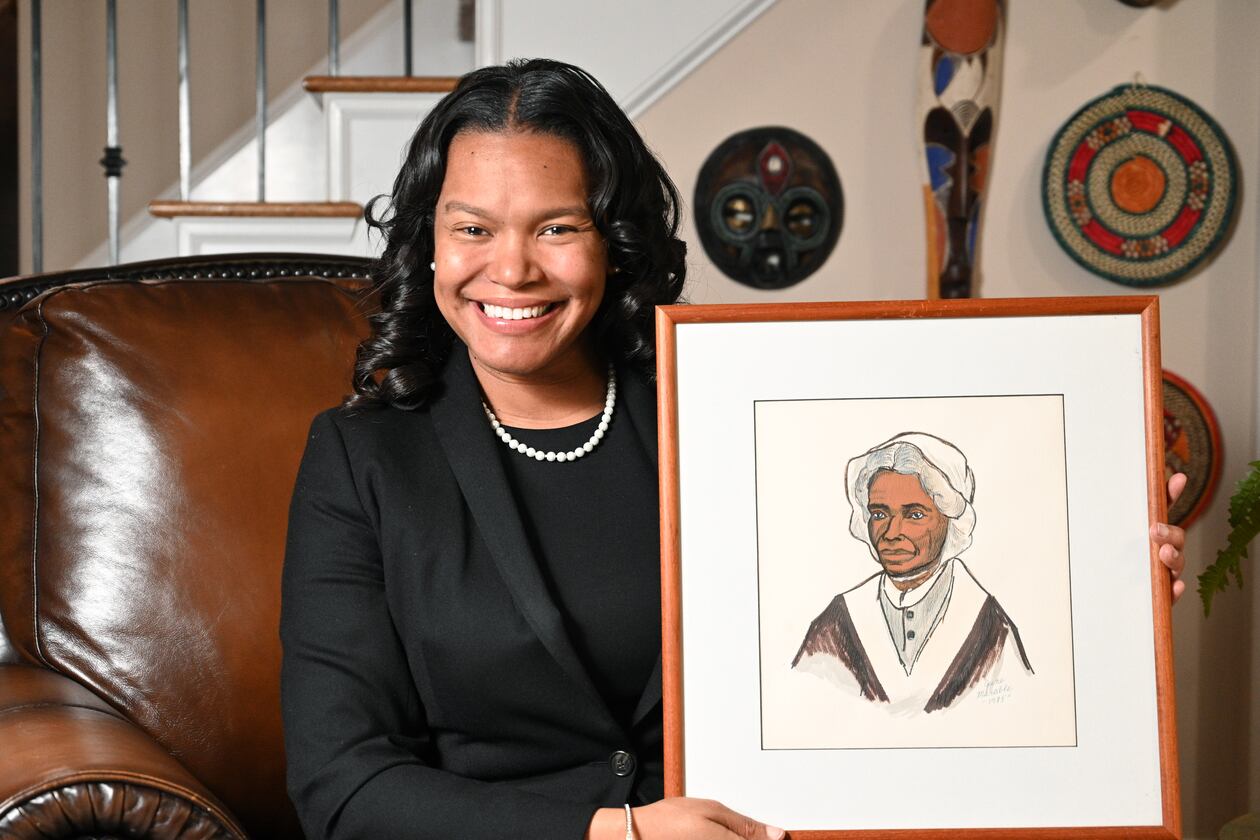 Sojourner Grimmett holds a drawing of Sojourner Truth that was drawn by her grandmother at her home, Thursday, Feb. 2, 2023, in Atlanta. Sojourner Grimmett was named after Sojourner Truth by her father, a noted scholar of black studies and biographer of Malcolm X. She says the name has had an impact on her life and her career. (Hyosub Shin / Hyosub.Shin@ajc.com)