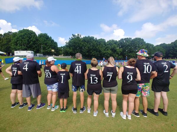 The Adams family of 10 all wore shirts noting how many years they have participated in the Atlanta Journal-Constitution Peachtree Road Race on Monday, July 4, 2022 in Atlanta. John Adams, who was accompanied by his children, grandkids, and great-grandkids, raced for his 41st year.