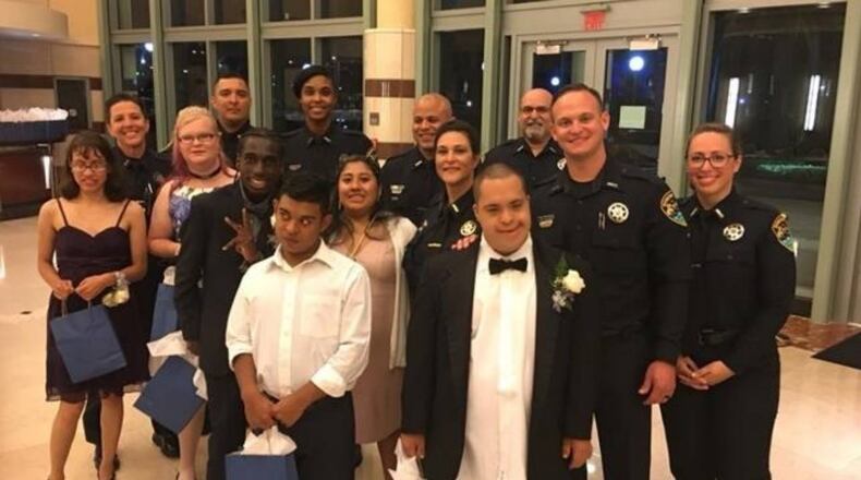 Officers from the Boynton Beach Police Department posed with their dates before Saturday night's prom.