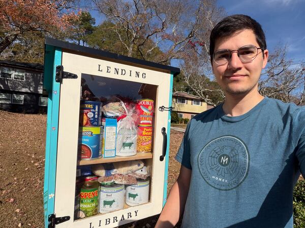 Ian Sager and his wife recently installed a Little Library in the front yard of their Toney Valley home. When SNAP benefits were cut, they decided to fill it with food. (Photo provided by Ian Sager)