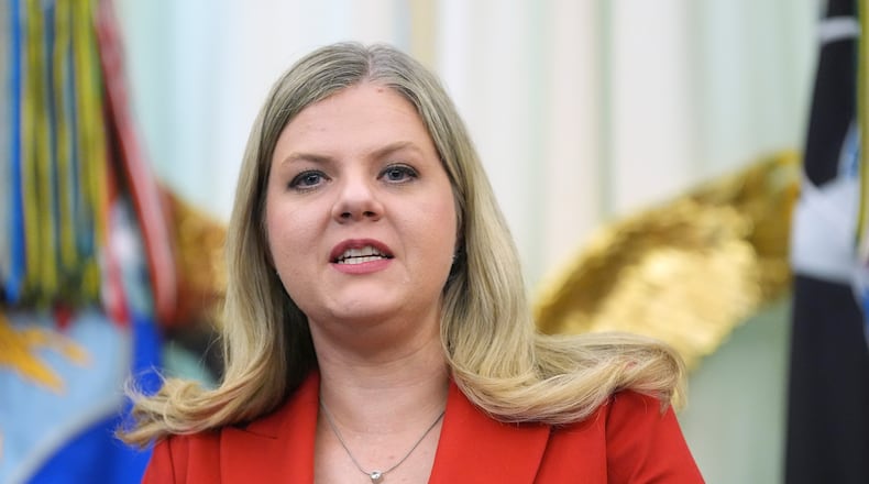 FILE - Heidi Overton, deputy director of the White House Domestic Policy Council, speaks during a meeting to sign an executive order about vaccines, Monday, Aug. 10, 2026, in the Oval Office of the White House in Washington. (AP Photo/Jacquelyn Martin, File)