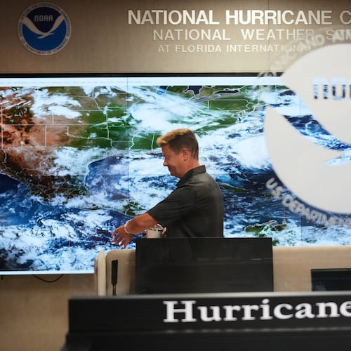 Robbie Berg, Warning Coordinator Meteorologist, works at the National Hurricane Center on the first day of hurricane season, Monday, June 1, 2026, in Miami. (AP Photo/Lynne Sladky)
