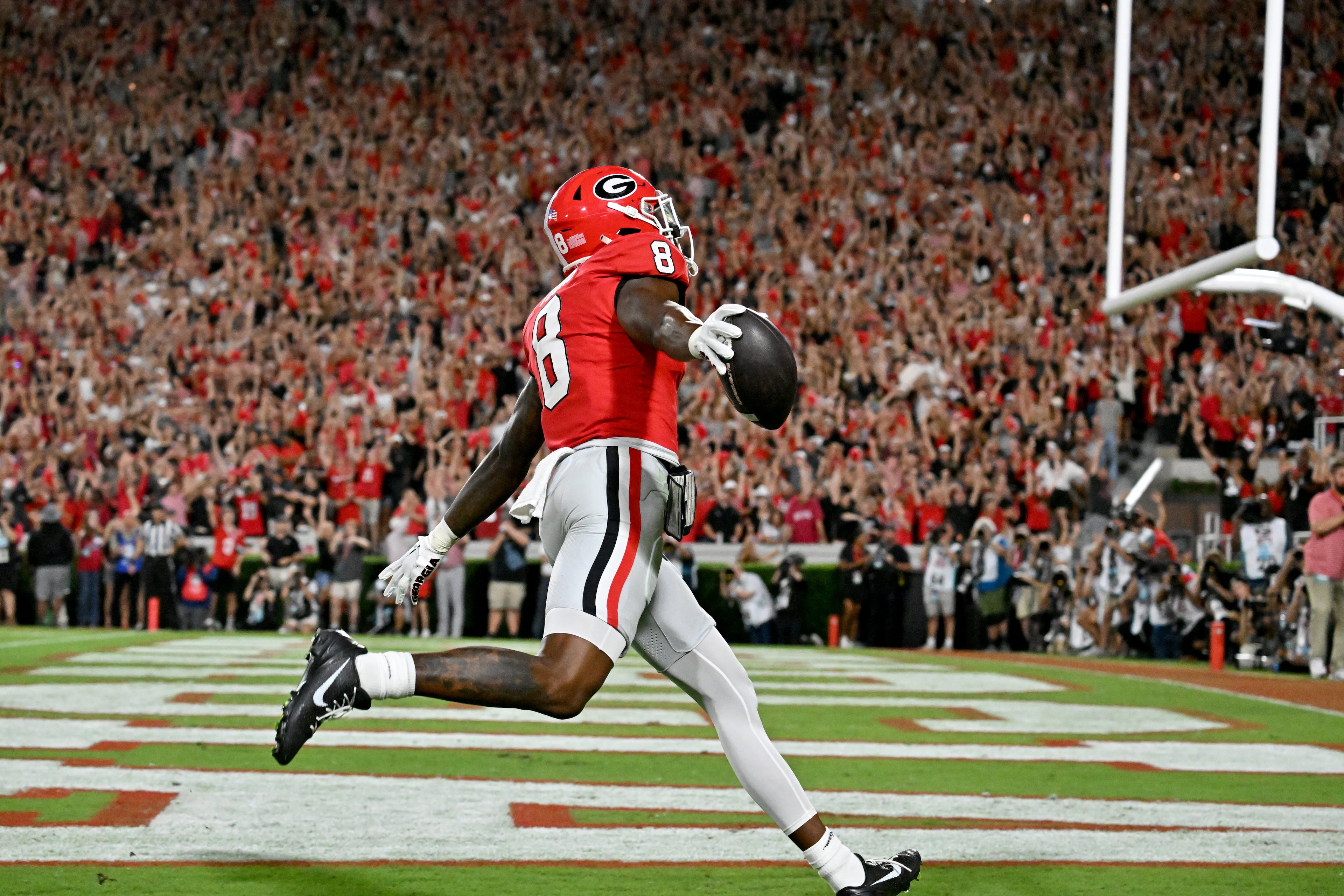 Georgia wide receiver Colbie Young (8) celebrates after scoring a touchdown catch during the first half in an NCAA football game at Sanford Stadium, Saturday, September 27, 2025, in Athens. (Hyosub Shin / AJC)