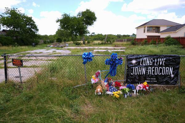Candles, flowers, and notes are placed at a makeshift memorial in San Antonio, on Thursday, June 5, 2025, for voice actor Jonathan Joss who was recently killed. (AP Photo/Eric Gay)