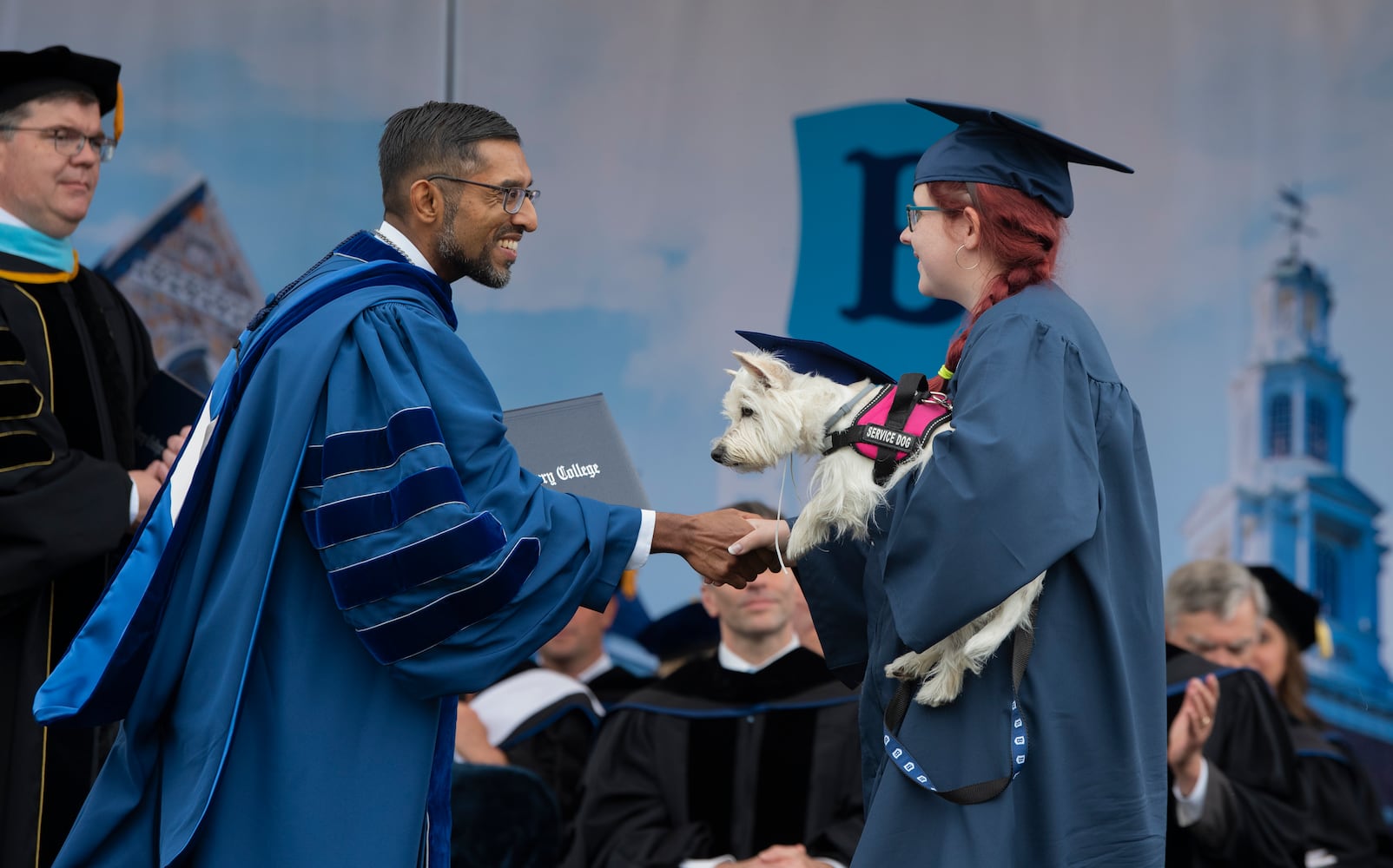 Graduate Abigail Yerke accepts her bachelor of science diploma with her service dog, Ruby, from Berry College President Sandeep Mazumder on Saturday, May 9, 2026. (Jonathan Garcia/Berry College)