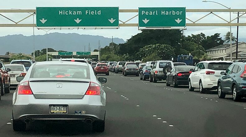 Traffic backs up at the main gates after a shooting at Pearl Harbor Naval shipyard, Wednesday, Dec. 4, 2019, near Pearl Harbor in Honolulu.