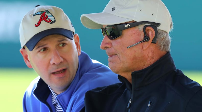 February 16, 2017, Lake Buena Vista, FL: Braves GM John Coppolella (left) and President of Baseball Operations John Hart confer while watching team practice at Champion Stadium on Thursday Feb. 16, 2017, at the ESPN Wide World of Sports in Lake Buena Vista. Curtis Compton/ccompton@ajc.com