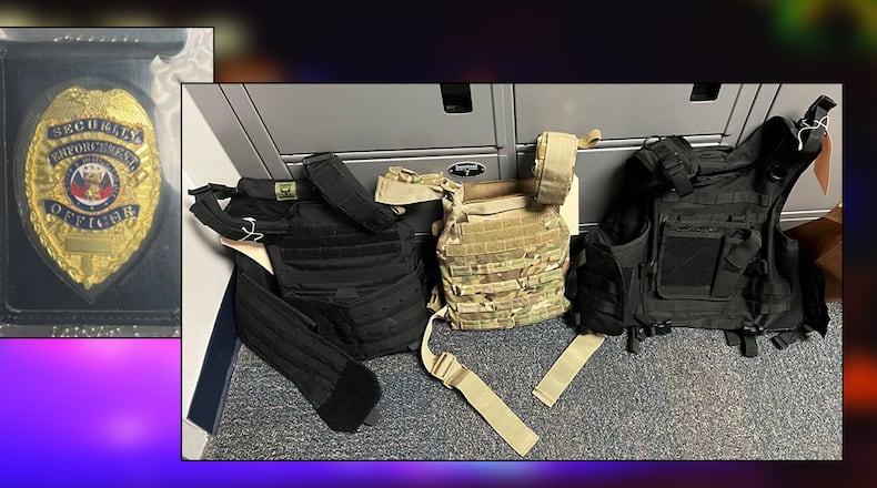 A police badge and tactical gear found at a property associated with Luis Soto, who was accused of impersonating an officer during an armed home invasion and robbery in Lawrenceville, according to Gwinnett County police. A second suspect, Yenson Adrian Cedeno Acevedo, was arrested Friday.