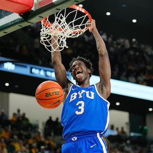 FILE - BYU forward AJ Dybantsa dunks in the first half of an NCAA college basketball game against Baylor Tuesday, Feb. 10, 2026, in Waco, Texas. (AP Photo/Tony Gutierrez, File