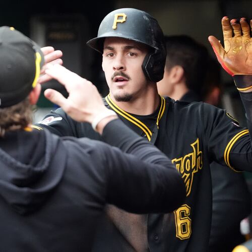 Pittsburgh Pirates' Konnor Griffin is greeted by his teammates after scoring on a single by Oneil Cruz against the Cincinnati Reds in the fourth inning of a baseball game in Pittsburgh, Saturday, May 2, 2026. (AP Photo/Tom E. Puskar)