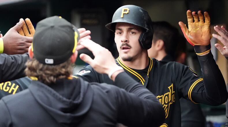 Pittsburgh Pirates' Konnor Griffin is greeted by his teammates after scoring on a single by Oneil Cruz against the Cincinnati Reds in the fourth inning of a baseball game in Pittsburgh, Saturday, May 2, 2026. (AP Photo/Tom E. Puskar)