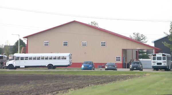 This image taken from video provided by WCIA shows first responders working the scene after a car smashed through a building during an after-school program, killing multiple people Monday, April 28, 2025, in Chatham, Ill. (WCIA via AP)