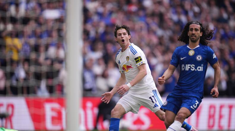Leeds' Brenden Aaronson, center, reacts after failing to score during the FA Cup semifinal soccer match between Chelsea and Leeds in London, England, Sunday, April 26, 2026. (AP Photo/Alastair Grant)