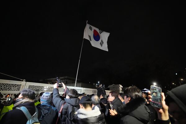 FILE - People try to enter the National Assembly in Seoul, South Korea, on Dec. 3, 2024. (AP Photo/Lee Jin-man, File)