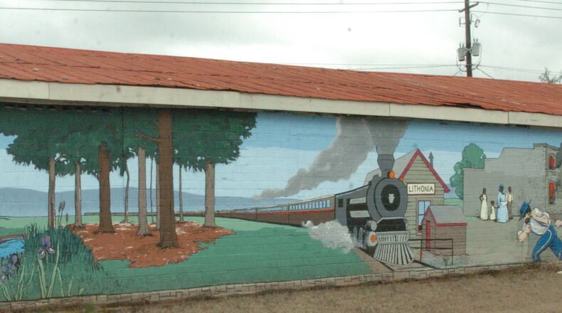 This is a mural of the history of the city of Lithonia located in the downtown area. (RENEE HANNANS HENRY/AJC staff)
