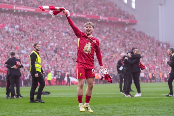 Liverpool's Harvey Elliott celebrates after winning the English Premier League soccer match between Liverpool and Tottenham Hotspur and clinching the Premier League title at Anfield in Liverpool, England, Sunday, April 27, 2025. (AP Photo/Jon Super)