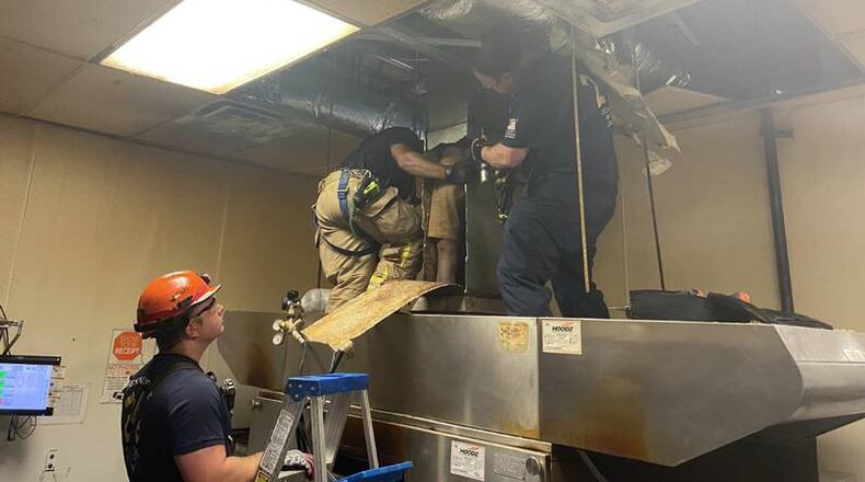 Firefighters and police were called to the Little Caesars at 6746 Covington Highway in Lithonia around 9:20 a.m. to help the man, DeKalb County officials confirmed.