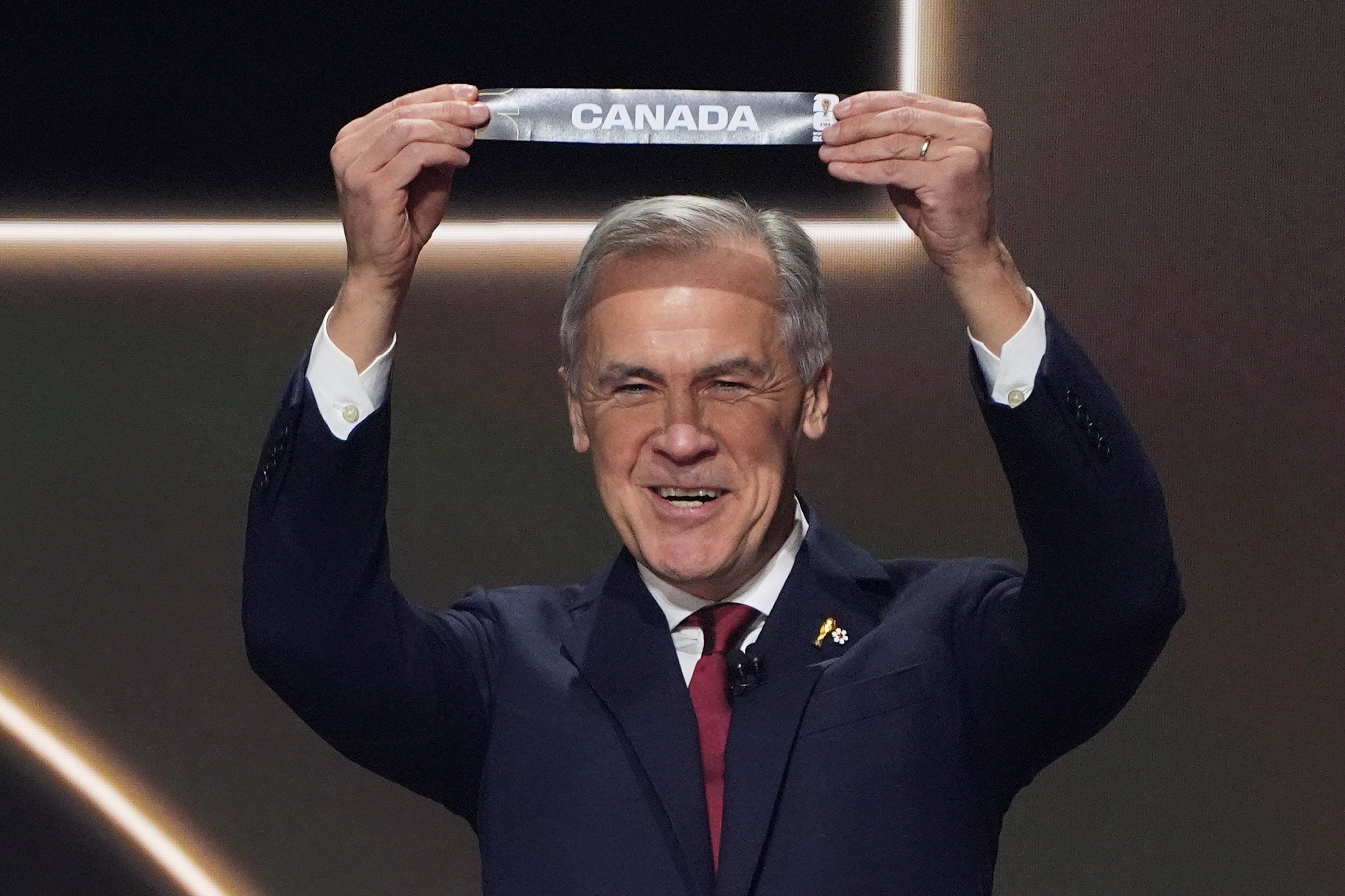 Canadian Prime Minister Mark Carney during the draw for the 2026 soccer World Cup at the Kennedy Center in Washington, Friday, Dec. 5, 2025.(AP Photo/Evan Vucci)