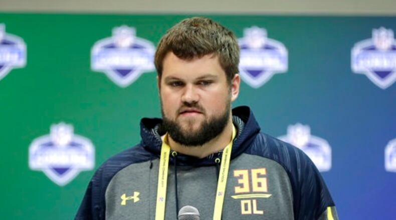 In this March 2, 2017 file photo, Wisconsin offensive lineman Ryan Ramczyk speaks during a news conference at the NFL football scouting combine in Indianapolis. NFL teams have to project how shrewdly and swiftly the new prospects will adjust to the pro game because most of them have never gotten into a three-point stance to blow his opponent off the ball or been asked to maintain a block for several seconds while his quarterback searches for his target. (AP Photo/David J. Phillip)