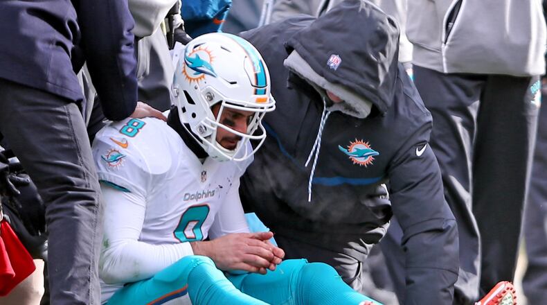 Miami Dolphins quarterback Matt Moore sits on the field after being hit by Pittsburgh Steelers' Bud Dupree in the second quarter in the NFL Wild Card Playoffs on Sunday, Jan. 8, 2017 at Heinz Stadium in Pittsburgh, Pa. (Charles Trainor Jr./Miami Herald/TNS)