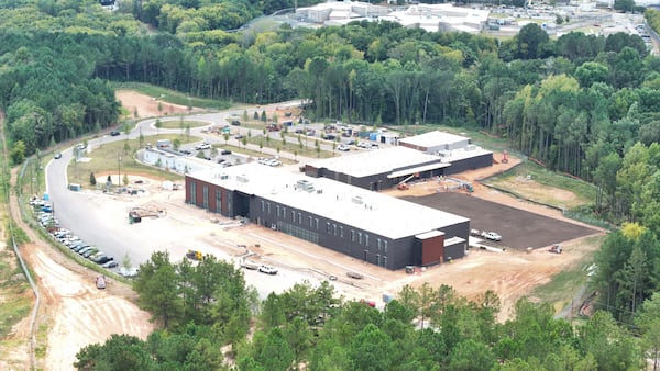 This aerial image shows the progress of the city's controversial public safety training center, which authorities say will be completed in December. (Miguel Martinez/AJC 2024)