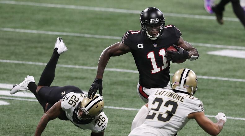 Falcons wide receiver Julio Jones makes a first-down reception against the New Orleans Saints during the first half Sunday, Dec. 6, 2020, at Mercedes-Benz Stadium in Atlanta.  (Curtis Compton / Curtis.Compton@ajc.com)