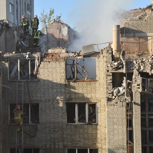 Rescuers search through the rubble of a residential building following air attack in Lviv, Ukraine, Thursday, July 30, 2026. (AP Photo/Mykola Tys)