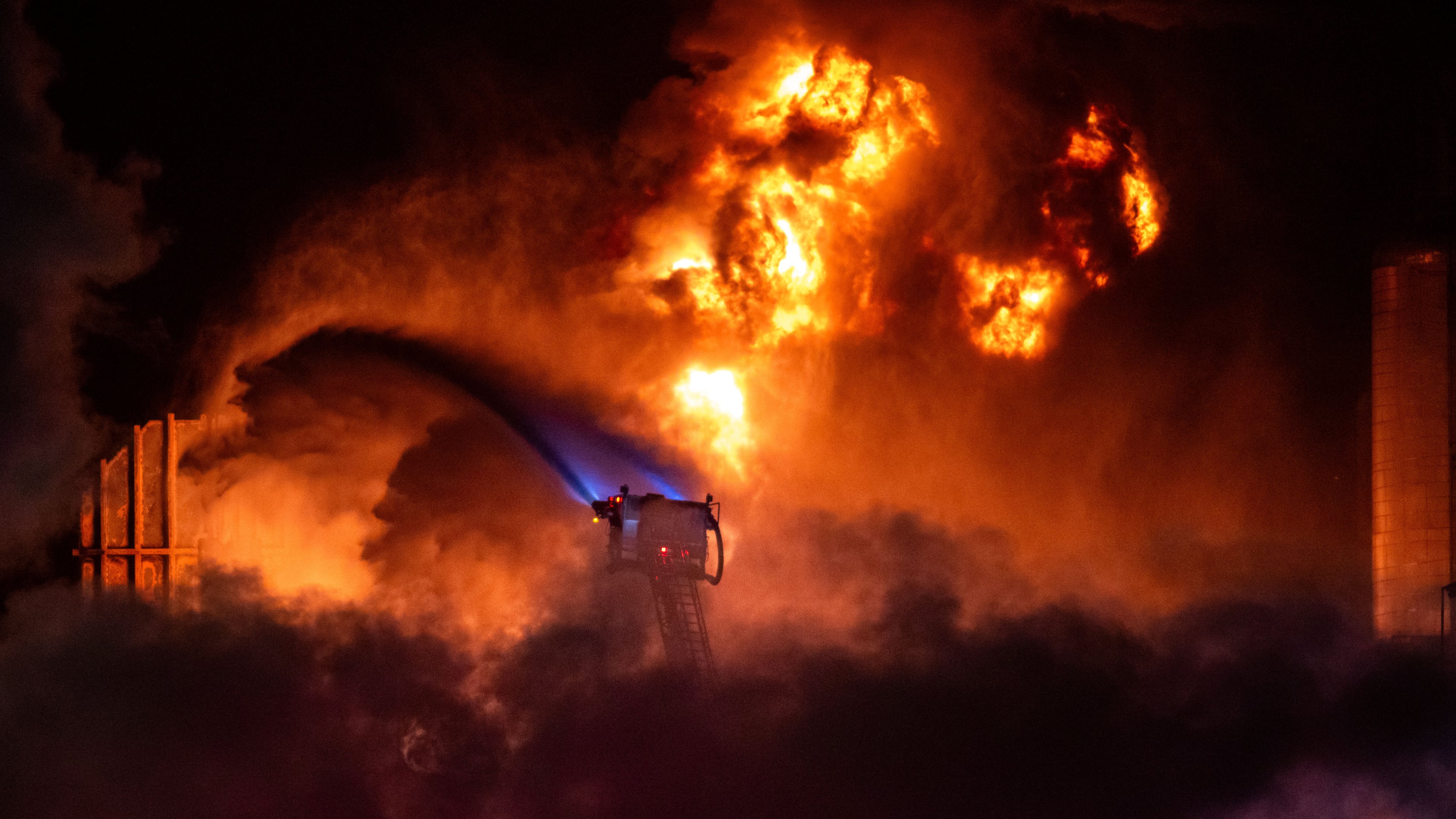 Flames rise from the Chevron refinery in El Segundo, Calif., Thursday, Oct. 2, 2025. (AP Photo/Ethan Swope)