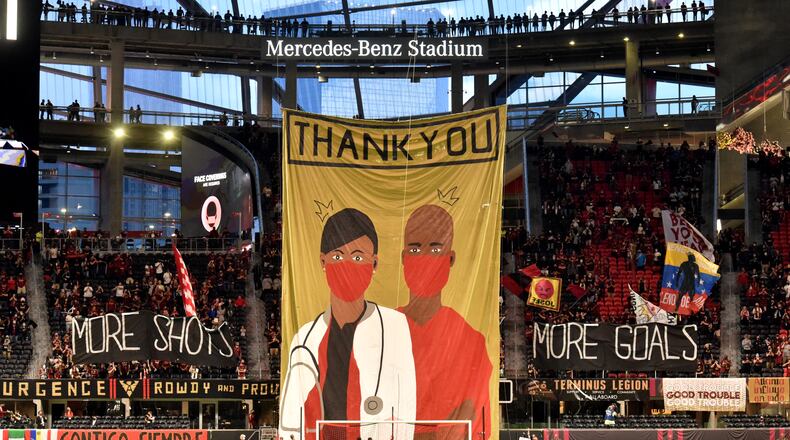 April 24, 2021 Atlanta - Atlanta United fan raise a giant “Thank you” banner before the game against Chicago Fire during a MLS soccer match at Mercedes-Benz Stadium in Atlanta on Saturday, April 24, 2021. (Hyosub Shin / Hyosub.Shin@ajc.com)