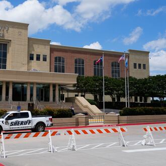 A Collin County seriff drives past the front of the county courthouse Thursday, June 4, 2026, in McKinney, Texas. (AP Photo/Tony Gutierrez)