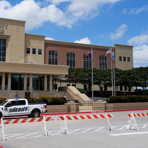 A Collin County seriff drives past the front of the county courthouse Thursday, June 4, 2026, in McKinney, Texas. (AP Photo/Tony Gutierrez)