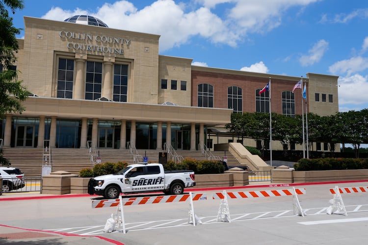 A Collin County seriff drives past the front of the county courthouse Thursday, June 4, 2026, in McKinney, Texas. (AP Photo/Tony Gutierrez)