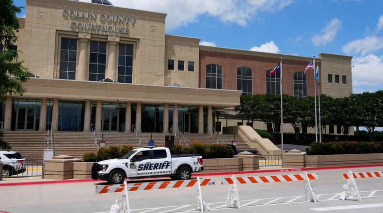 A Collin County seriff drives past the front of the county courthouse Thursday, June 4, 2026, in McKinney, Texas. (AP Photo/Tony Gutierrez)
