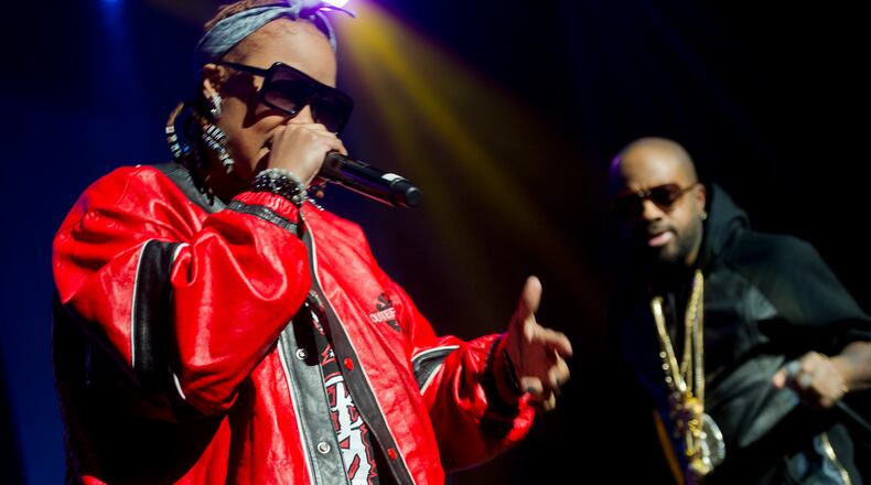 Da Brat (left) performs on stage at the Fox Theatre in Atlanta with Jermaine Dupri during the So So Def 20th Anniversary Concert on February 23, 2013.