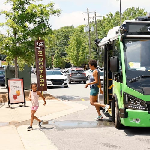 Passengers are seen getting off an ATL Spoke bus as they arrive at the Lee + White District on Monday, June 1, 2026. The ATL Spoke, an autonomous pilot program, began offering service recently. It connects the West End MARTA station and the Lee + White District. It operates seven days a week. (Miguel Martinez/AJC)