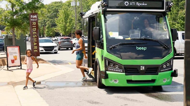 Passengers are seen getting off an ATL Spoke bus as they arrive at the Lee + White District on Monday, June 1, 2026. The ATL Spoke, an autonomous pilot program, began offering service recently. It connects the West End MARTA station and the Lee + White District. It operates seven days a week. (Miguel Martinez/AJC)