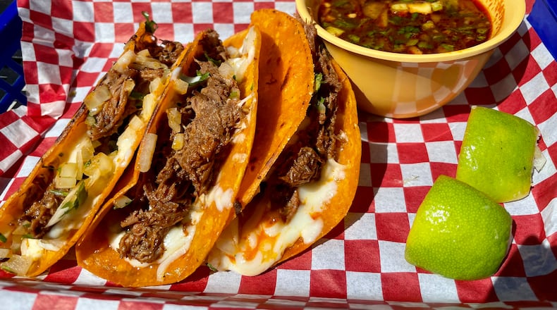 The tacos de birria at Frida’s Taqueria feature brisket-like beef that is fall-apart tender. Angela Hansberger for The Atlanta Journal-Constitution