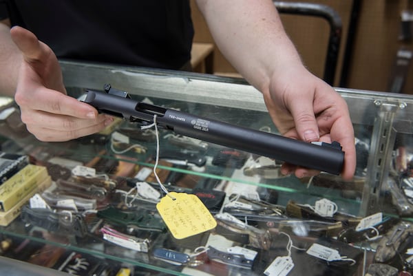 FILE - A silencer is displayed at Ed's Public Safety gun shop in Stockbridge, Ga., Jan. 31, 2017. (AP Photo/Lisa Marie Pane, File)
