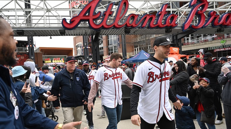 Braves first baseman Matt Olson (foreground) and third baseman Austin Riley greet fans as they walk to Georgia Power Pavilion Stage during Braves Fest Opening Rally at The Battery Atlanta, Saturday, Jan. 21, 2023, in Atlanta. (Hyosub Shin / Hyosub.Shin@ajc.com)