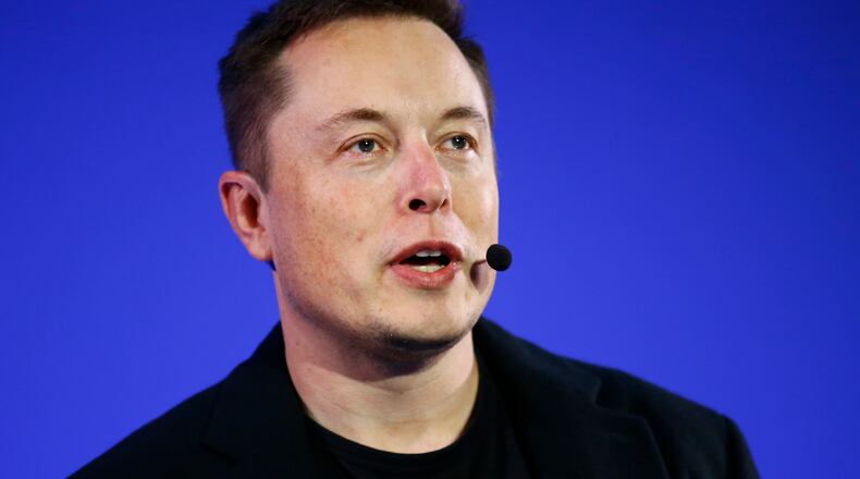 FILE - In this Wednesday, Dec. 2, 2015, file photo, Tesla Motors Inc. CEO Elon Musk delivers a conference at the Paris Pantheon Sorbonne University as part of the United Nations Climate Change Conference in Paris. Electric car maker Tesla Motors is offering to buy solar panel maker SolarCity for up to $2.8 billion in an attempt to create a one-stop shop for cleaner energy as consumers become more concerned about fossil fuels hurting the environment. The all-stock announced Tuesday, June 21, 2016, values SolarCity Corp. at $26.50 to $28.50 per share, depending on a review of the company's books. (AP Photo/Francois Mori, File)