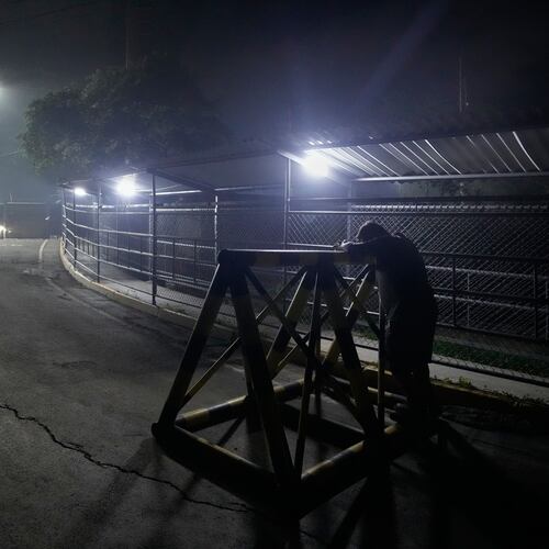 A relative of a political prisoner waits outside the Rodeo I prison in Guatire, Venezuela, Thursday, Jan. 8, 2026, after National Assembly President Jorge Rodriguez said the government would release Venezuelan and foreign prisoners. (AP Photo/Matias Delacroix)