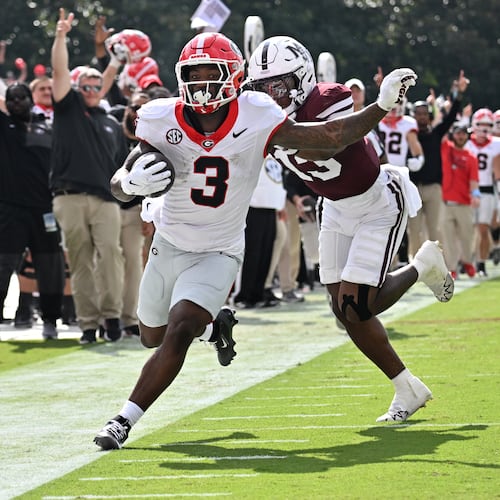Georgia running back Nate Frazier (3) runs down the sidelines until he is pushed by Mississippi State safety Jahron Manning (13) during the first half in an NCAA football game at Davis Wade Stadium, Saturday, November 8, 2025, in Starkville, Mississippi. (Hyosub Shin / AJC)