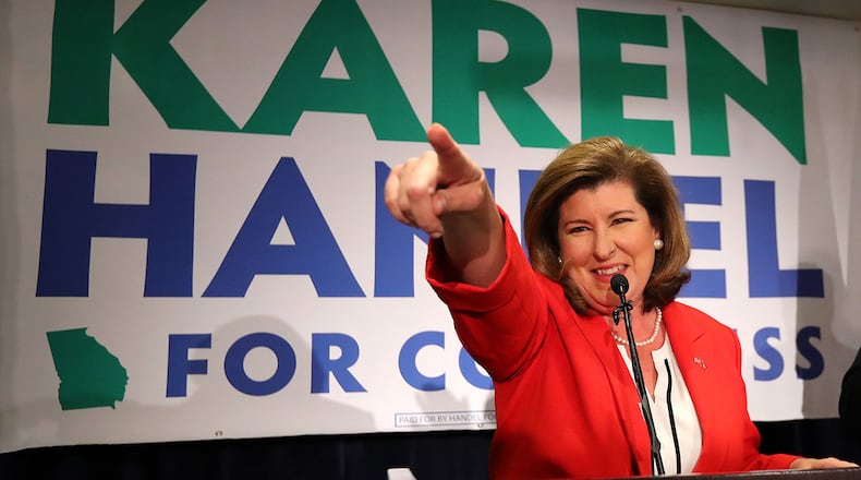 June 20, 2017, Atlanta: Karen Handel points at her supporters while thanking them during an early appearance after the first returns come in during her election night party in the 6th District race with Jon Ossoff on Tuesday, June 20, 2017, in Atlanta.    Curtis Compton/ccompton@ajc.com