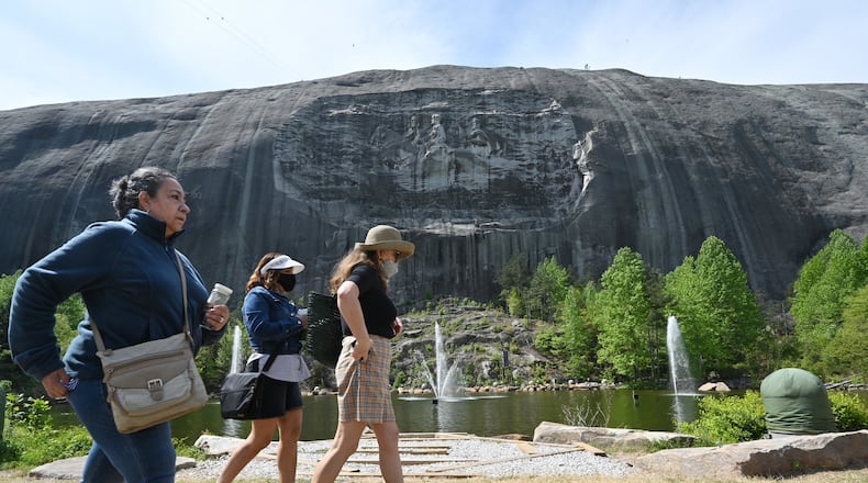 April 20, 2021 Stone Mountain - Park goers walk around  the Memorial Lawn at Stone Mountain Park on Tuesday, April 20, 2021. (Hyosub Shin / Hyosub.Shin@ajc.com)